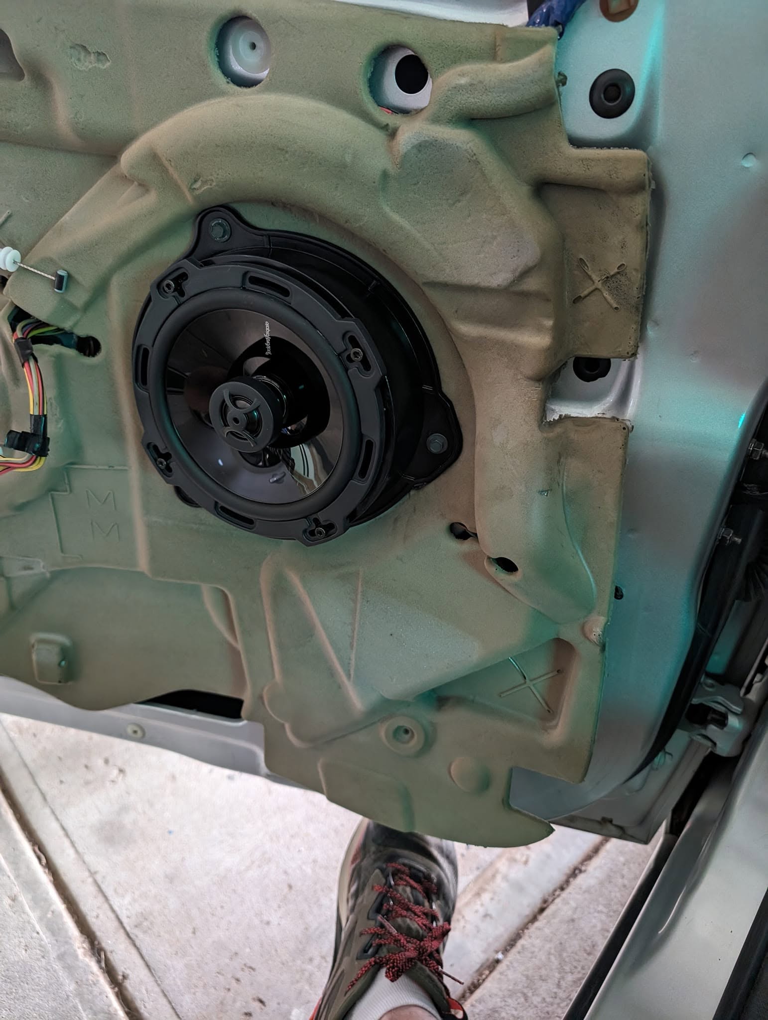 Door trim off, showing the replacement speaker fitted