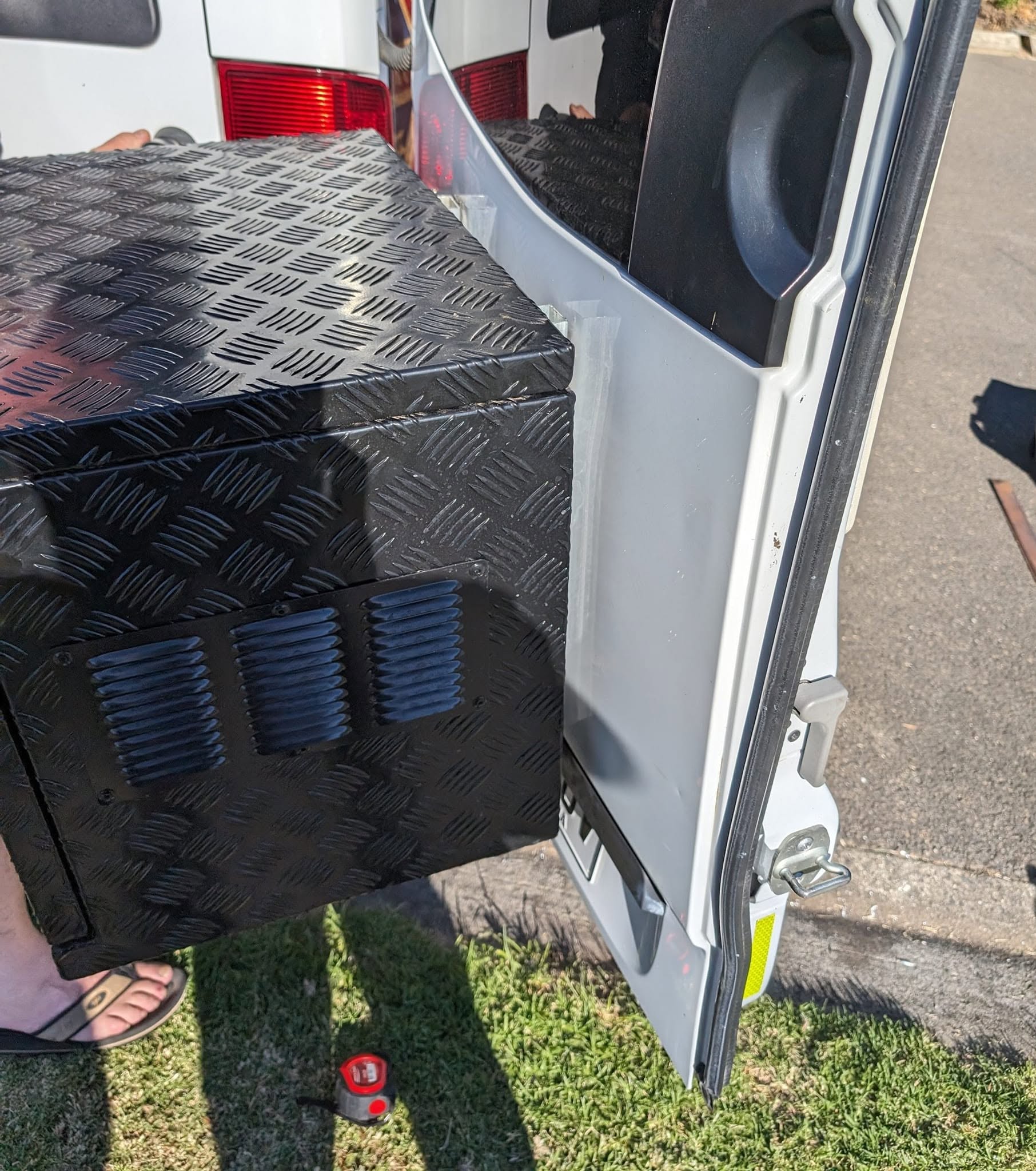 Checkerplate toolbox fitted into the back of a van